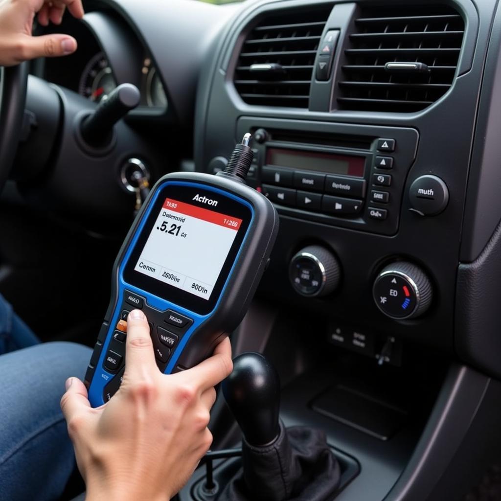 Using an Actron OBD 1 Scanner on a Vehicle