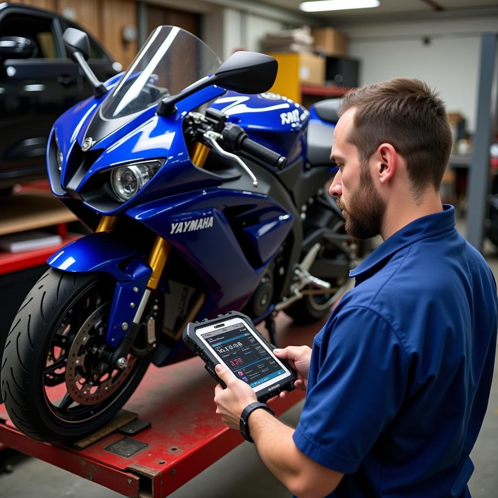 Mechanic using SBT Scan Tool on a Yamaha Motorcycle