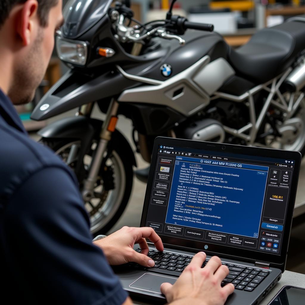 Mechanic using a laptop to diagnose a 2005 BMW R1200GS