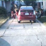 An image taken by a license plate reader on a San Leandro, Calif., police car shows Mike Katz-Lacabe and his daughters getting out of their Toyota Prius in their driveway. The image is one of 112 that Katz-Lacabe received in a 2010 public records request for license plate data on his vehicles collected by police.