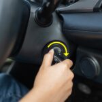 Locating the OBD2 port in your car, typically under the dashboard on the driver's side.