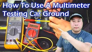 Testing car ground connection with a multimeter to diagnose why car won't start after scanner tool use.