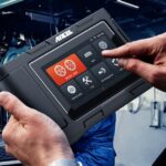 Step-by-step guide on how to use a scanner for car and truck diagnostics, showing a scanner connected to a truck's diagnostic port.