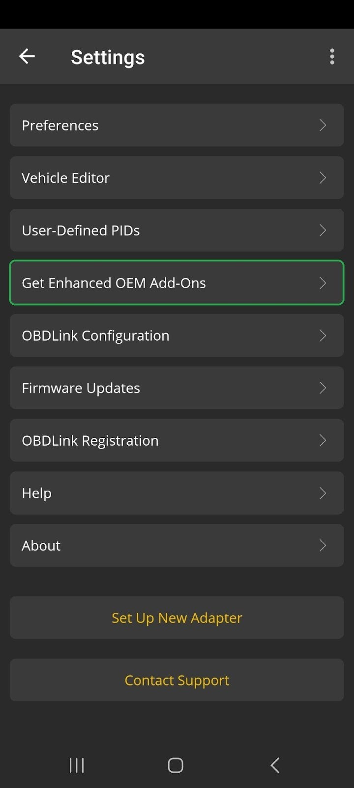 Android phone connected to an OBD-II adapter plugged into a car's diagnostic port.